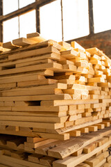 Stacked wooden planks in close-up at a outdoor lumber warehouse. Drying timber stack. Wood air drying.