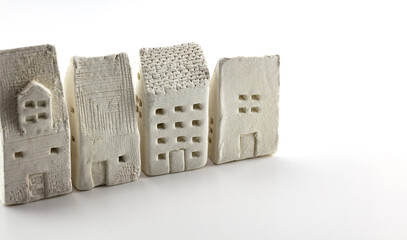 Urban real estate planning, Multi family homes. A house made of clay. shallow depth of field. 