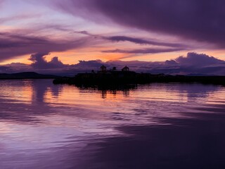 Naklejka premium Sunset over Lake Titicaca in Peru at night.