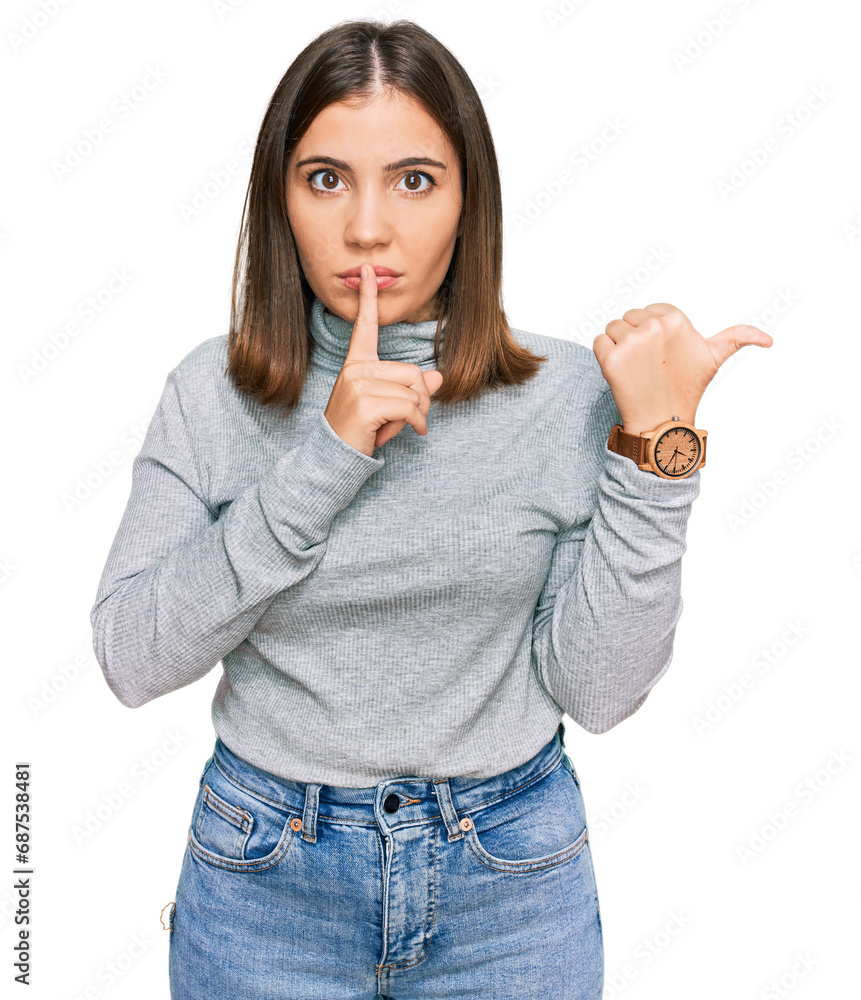 Poster young beautiful woman wearing casual turtleneck sweater asking to be quiet with finger on lips point