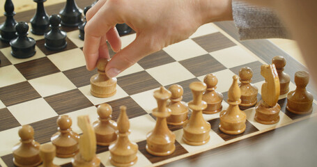 Chess game closeup photo - a person about to or making a move