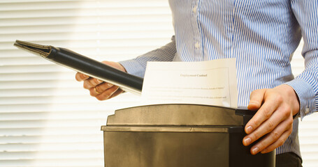 Business Woman Shreds a Contract