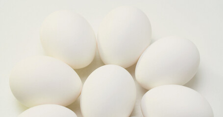 Many white chicken eggs. Food and food preparation concept.