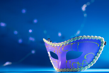carnival mask on a blue background, masquerade ball
