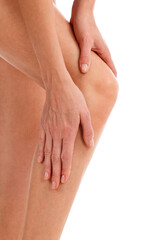 Closeup shot of woman holding sore knee, isolated