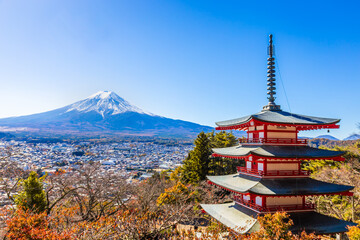 Chureito Red Pagoda is a five-story pagoda with a beautiful backdrop of Mount Fuji, a popular and famous place considered a symbol of Japan. - obrazy, fototapety, plakaty