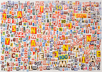 Alphabet letters and numbers cut from magazines and newspapers