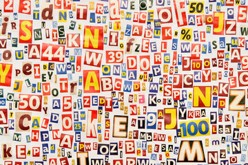 Alphabet pattern of letters and numbers cut from magazines