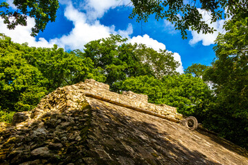 Coba Maya Ruins ancient buildings pyramids in tropical jungle Mexico.