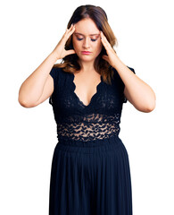 Young beautiful caucasian woman wearing elegant dress suffering from headache desperate and stressed because pain and migraine. hands on head.