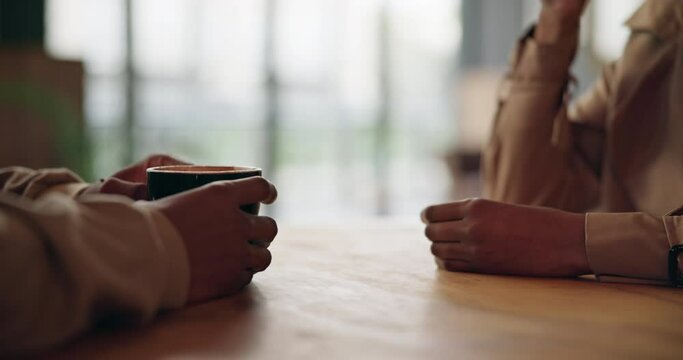 Hands on table, coffee and date in cafe, man and woman bonding chat together in breakfast diner. Relationship, morning drink and people meeting for connection, love and couple relax in restaurant.