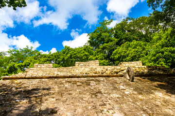 Coba Maya Ruins ancient buildings pyramids in tropical jungle Mexico.