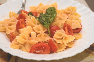 Italian Farfalle Pasta With Tomatoes, Cheese And Basil