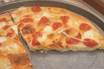 Homemade Pizza With Tomatoes And Mozzarella Cheese