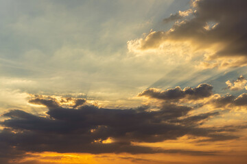 Fototapeta premium The blue sky is orange and the clouds are soft when the sun is about to set.