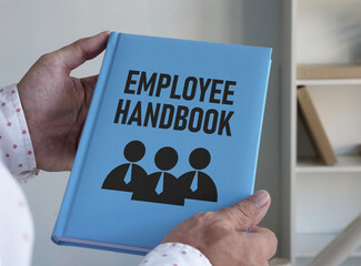Employee handbook and HR compliance is shown on the photo using the text - obrazy, fototapety, plakaty