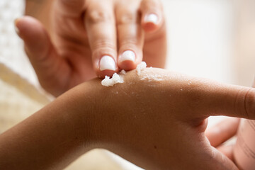 woman applying nail polish