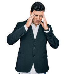 Handsome hispanic man wearing business clothes with hand on head, headache because stress. suffering migraine.