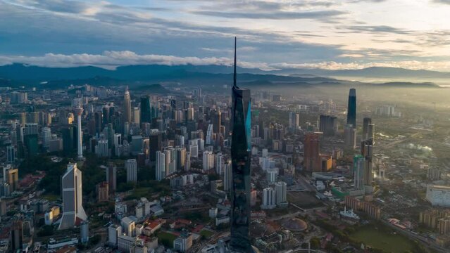 Aerial view time lapse 4k video of Kuala Lumpur city center view during dawn overlooking the city skyline in Federal Territory, Malaysia. 