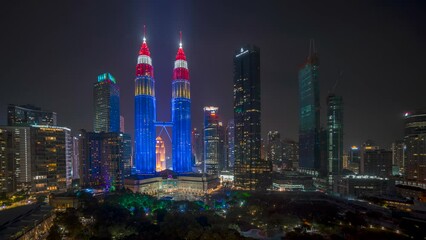 4k time lapse of night scene on Independence eve day at Kuala Lumpur city center with fireworks and light show. 