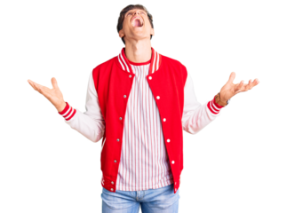 Young handsome man wearing baseball uniform crazy and mad shouting and yelling with aggressive expression and arms raised. frustration concept.