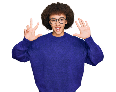 Young hispanic girl wearing casual winter sweater and glasses showing and pointing up with fingers number eight while smiling confident and happy.
