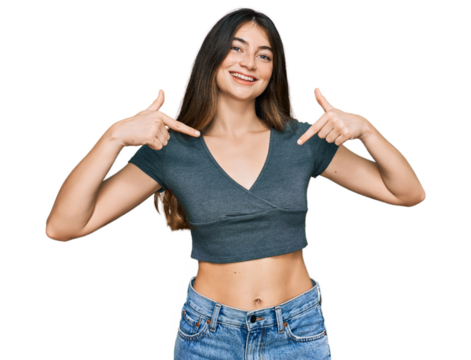 Young beautiful teen girl wearing casual crop top t shirt looking confident with smile on face, pointing oneself with fingers proud and happy.