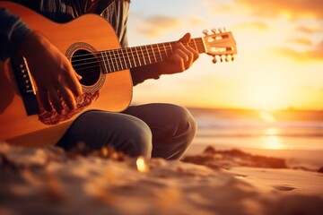 Persona tocando una guitarra frente a un atardecer de playa, creando un ambiente relajado y musical - obrazy, fototapety, plakaty