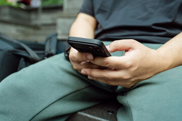 Man playing game on mobile phone. gamer boy playing video games holding Smartphone working mobile devices. cell telephone technology e-commerce concept