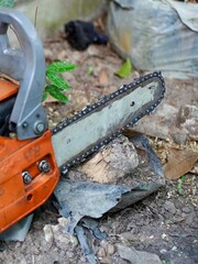 Chain saw, power saw, sawing machine ,Modern chain saw and firewood,closeup.