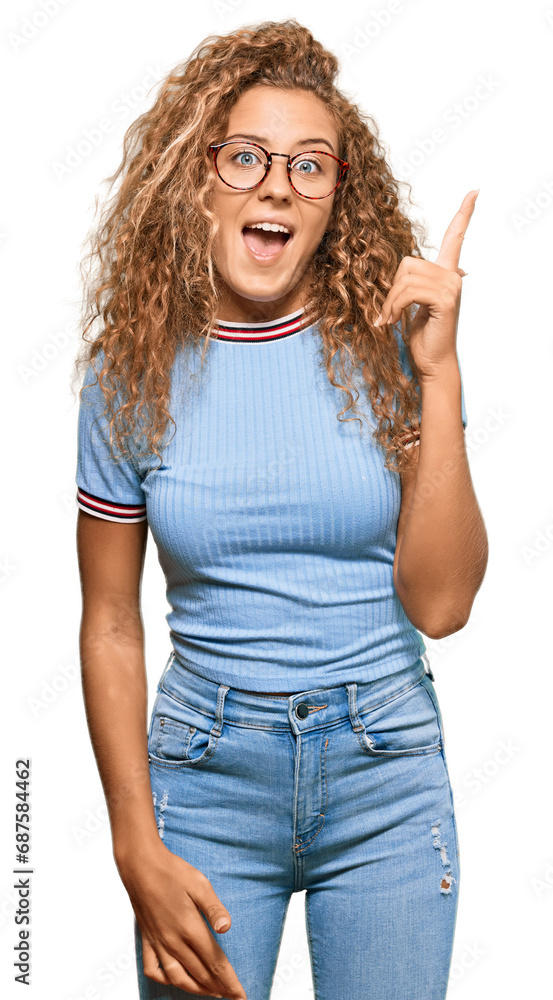 Poster beautiful caucasian teenager girl wearing casual clothes and glasses pointing finger up with success