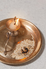 Puja or Arti thali with a brass oil lamp for worshipping the Hindu God.