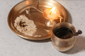 Puja or Arti thali with a brass oil lamp for worshipping the Hindu God.