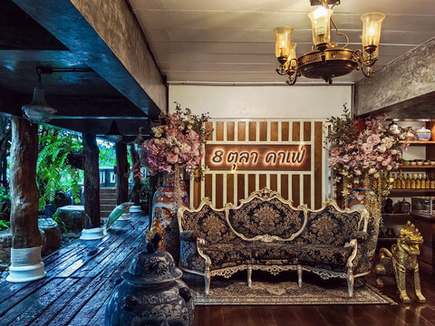 NAKHON SI THAMMARAT, THAILAND - NOVEMBER 26,2023 : The interior of cafe decorated with beautiful antique collectibles and comfortable seats perfect for relaxing with delicious coffee at 8 OCT. CAFE.