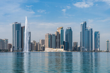 Panorama of the center of the Emirate of Sharjah, United Arab Emirates . Corniche area of Sharjah, UAE city.