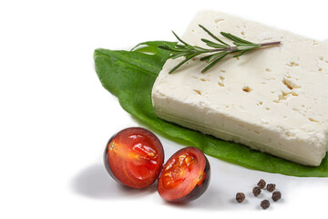 Wole Feta cheese isolated on white background clipping Heap of Feta cheese, basil leaves and...