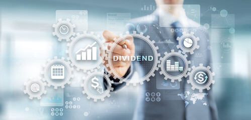 Dividends button on virtual screen. Return on Investment ROI financial business wealth concept.