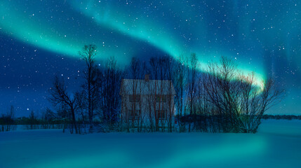 Green northern lights over rural county house of northern Norway