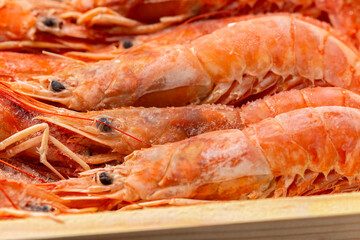 Frozen king prawns, sea food in wooden box