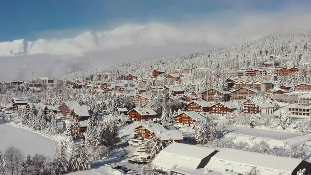 Aerial view of the ski resort Crans Montana in Valais, Switzerland in winter, covered by fresh snow