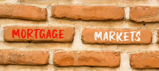 Mortgage markets symbol. Concept words Mortgage markets on beautiful brown brick wall. Beautiful brown brick wall background. Business mortgage markets concept. Copy space.