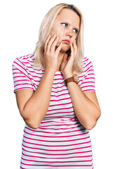 Young caucasian woman wearing casual clothes tired hands covering face, depression and sadness, upset and irritated for problem