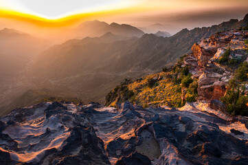 Fototapeta na wymiar Colorful landscape background at sunrise in the Asir Mountains in Saudi Arabia.