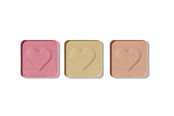 Top view of set pastel color eye shadow swatch isolated on white background with shadow, eyeshadows with heart imprint, colored powder for makeup, square shape in metal pack, design object