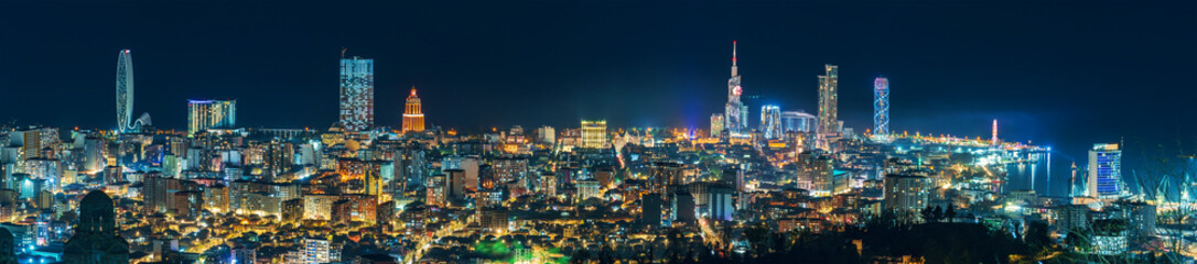 Batumi night cityscape wide panorama with modern hotels, tower buildings on Black Sea coast,...