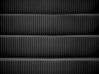 detail of metall stairs of an automatic escalator 