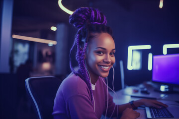 Smiling woman at computer with headphones in neon light. Concept of modern work life.