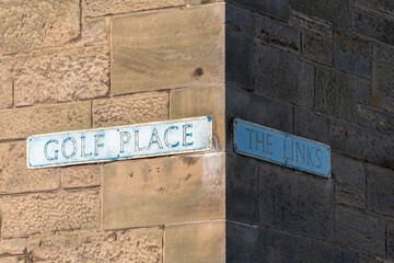 Intersection of Golf Place and The Links on a building in St Andrews
