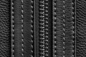 Black leather jacket background. Autumn clothing. Autumn winter fashion texture. Closed fastener. Zipped zipper. Fabric design pattern. Metal silver shiny zipper teeth background. Thread seam texture.