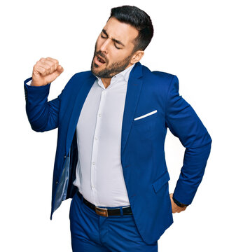 Young hispanic man wearing business jacket stretching back, tired and relaxed, sleepy and yawning for early morning